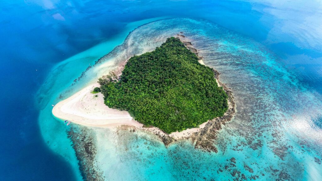 Aerial view of Bamboo Island and its ring of white sand