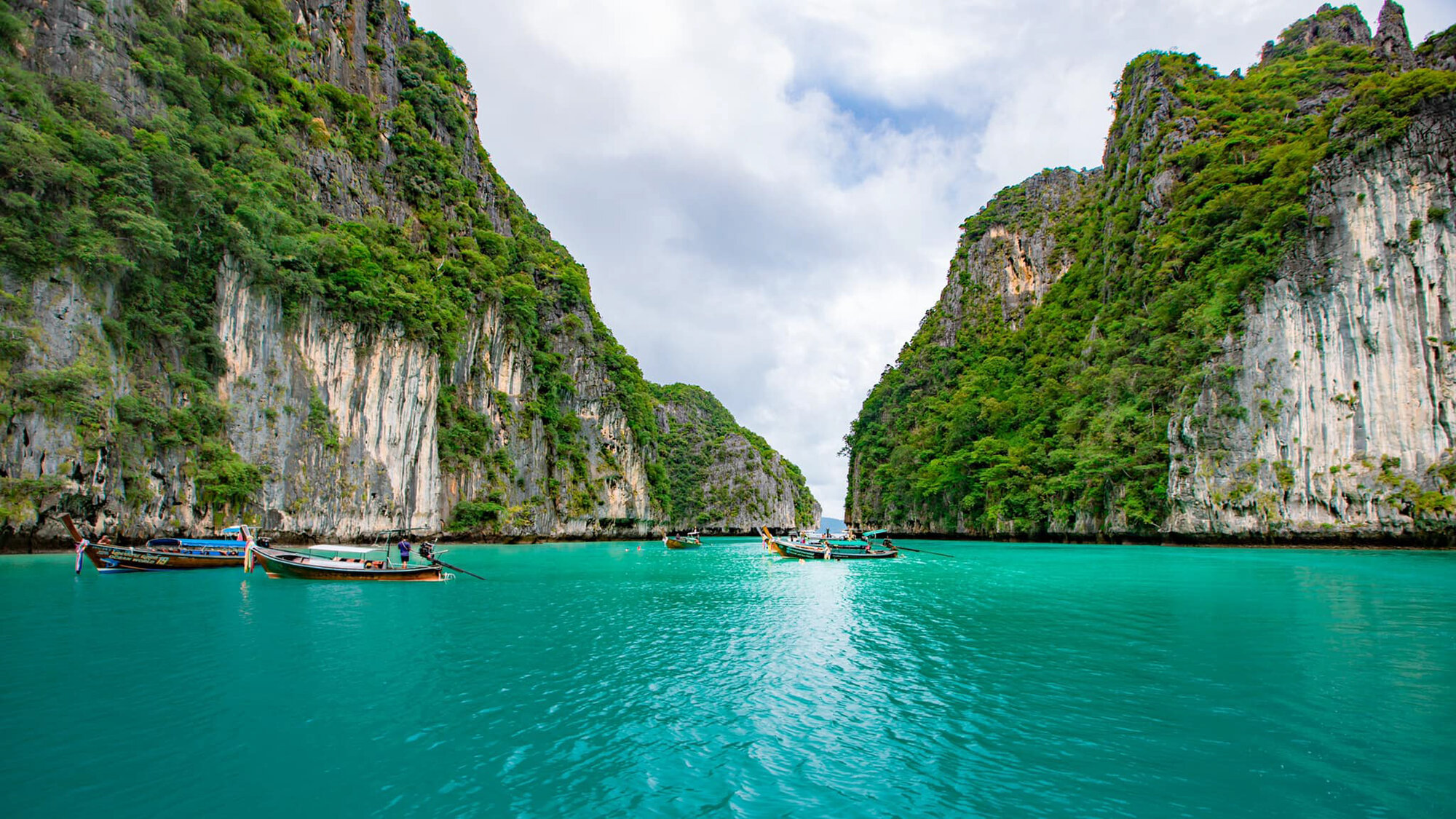 Boats in the emerald water of Pileh Lagoon