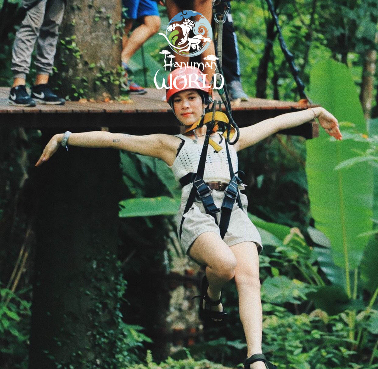 Guest on a zipline platform at Hanuman World