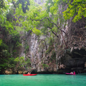 Canoe gliding through a limestone hong at Hong Island