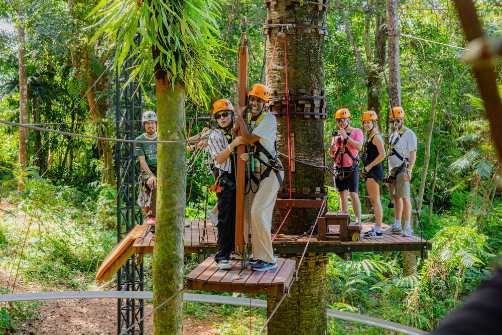 Group on a treetop platform with guides