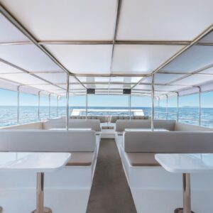 Shaded lounge deck with tables on the luxury yacht