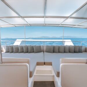 Rear lounge with cushioned seating on the yacht