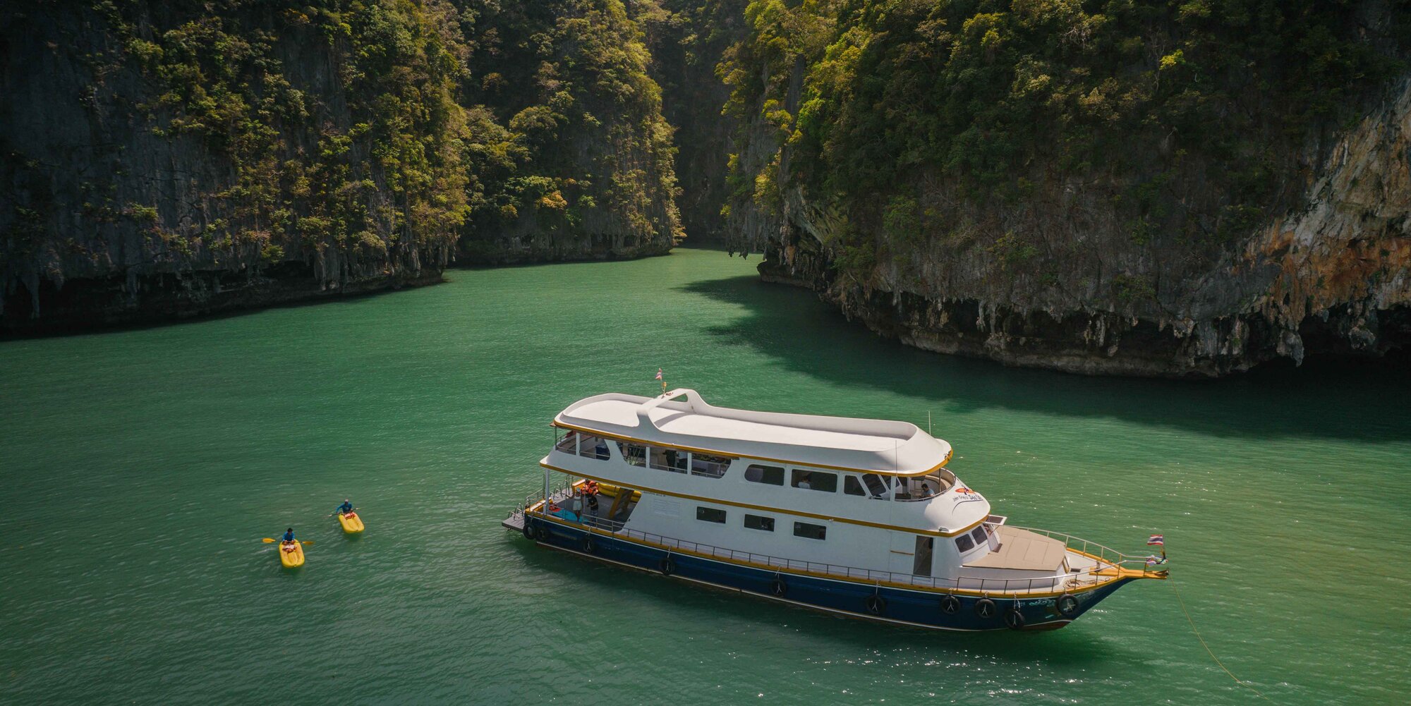 Tour boat in a sheltered bay in Phang Nga