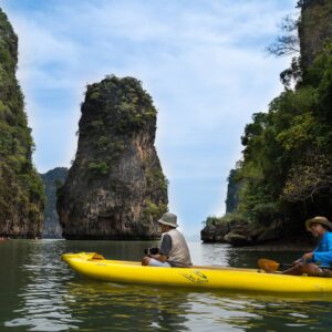 Kayak passing a limestone pinnacle