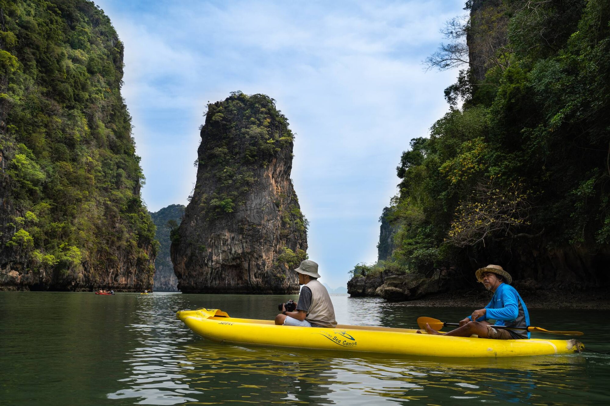 Kayak passing a limestone pinnacle