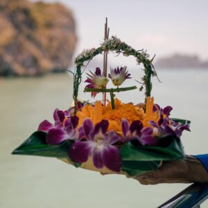 Handmade krathong float with flowers and candle