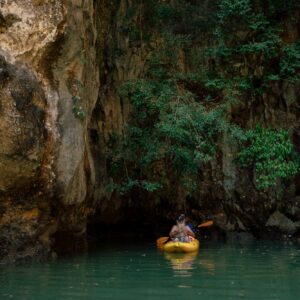 Kayak in a lagoon surrounded by cliffs