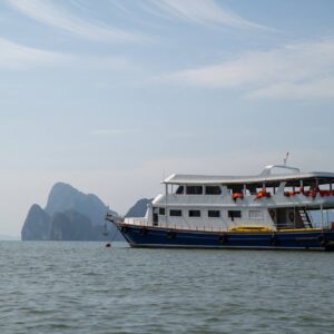 Tour boat anchored among islands in Phang Nga Bay