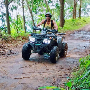 ATV on a muddy jungle trail