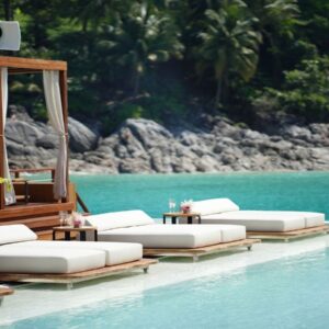 Pool daybeds facing the sea at a Phuket beach club