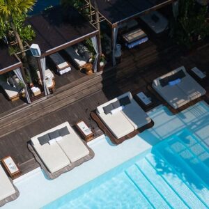 Aerial view of pool daybeds and cabanas