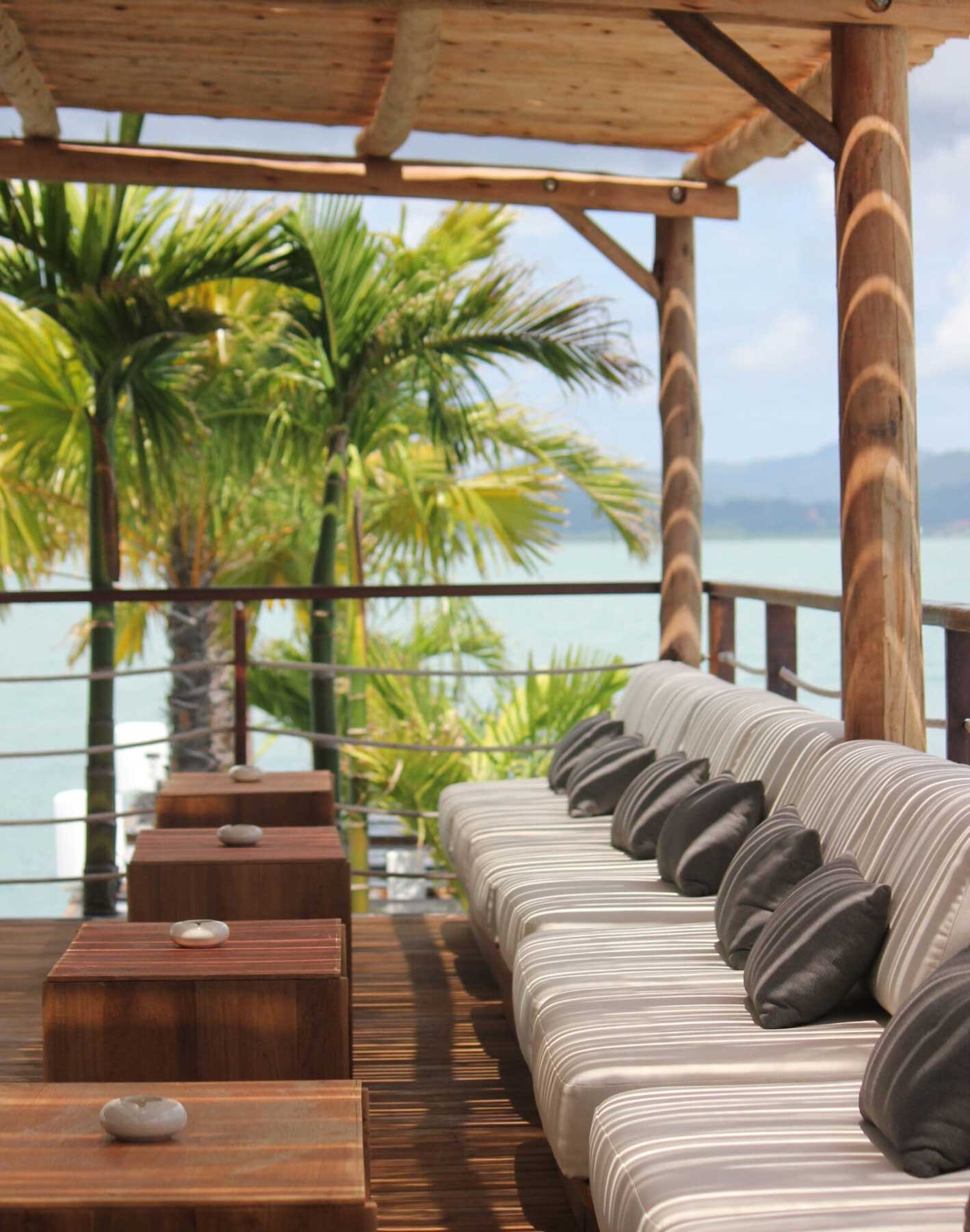 Lounge terrace with sea view under a bamboo roof
