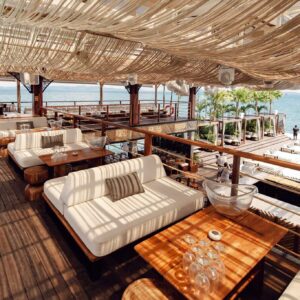 Shaded lounge area with sofas and tables