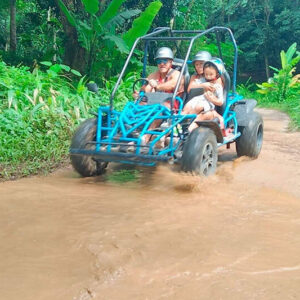 Off-road buggy splashing through mud