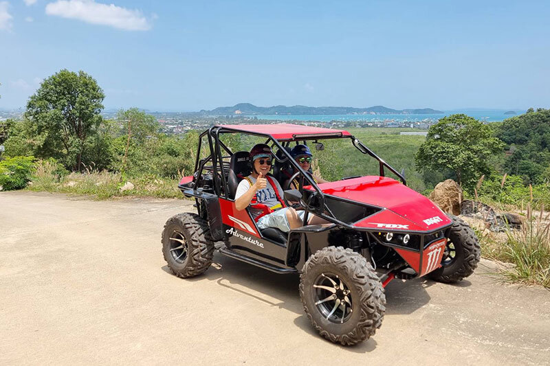 Red off-road buggy at a sea-view point