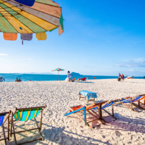 Beach chairs and umbrellas on white sand at Khai Island