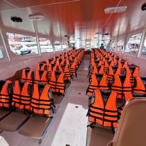 Covered cabin seating on a four-engine speedboat for big groups