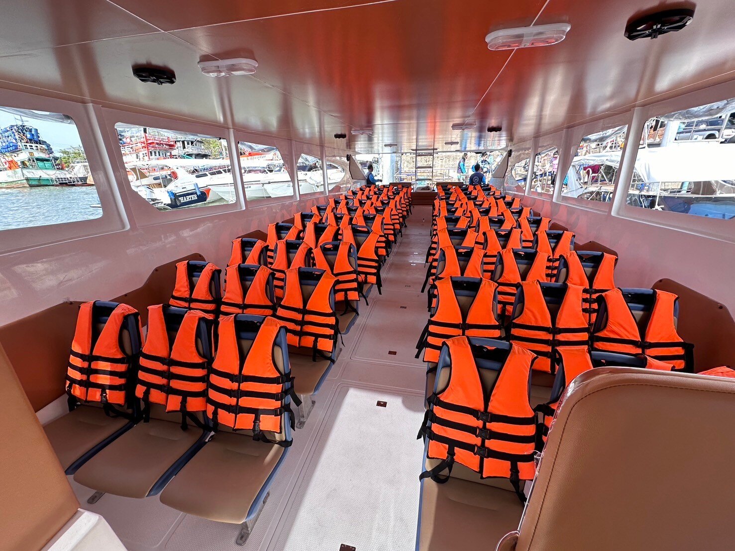 Covered cabin seating on a four-engine speedboat for big groups
