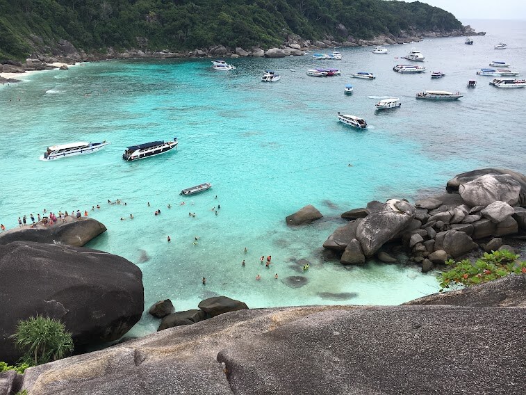 Boats in the turquoise bay below Sail Rock, Similan Islands