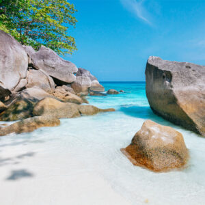 Granite boulders on a white sand beach in the Similan Islands