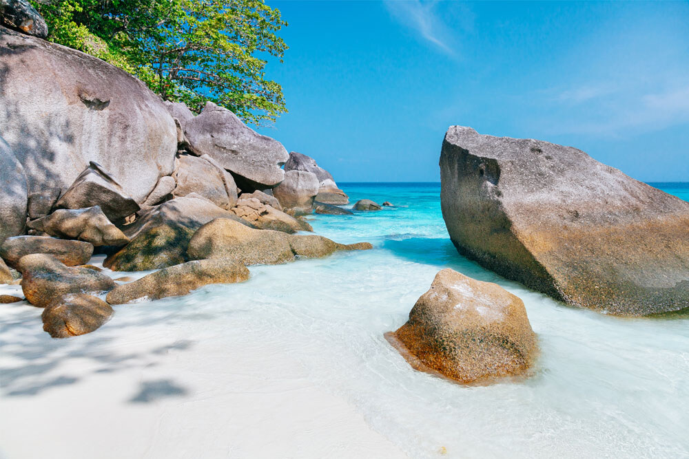 Granite boulders on a white sand beach in the Similan Islands