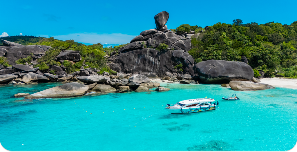 Speedboat anchored below Sail Rock in the Similan Islands