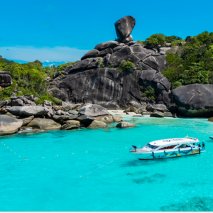 Speedboat anchored below Sail Rock in the Similan Islands