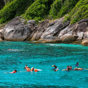 Snorkellers over the reef in the Similan Islands