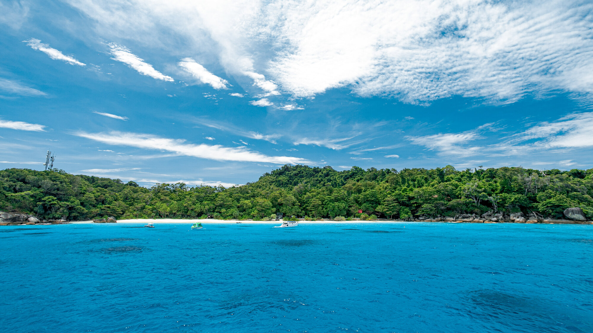 A forested island seen from the boat in the Similan Islands