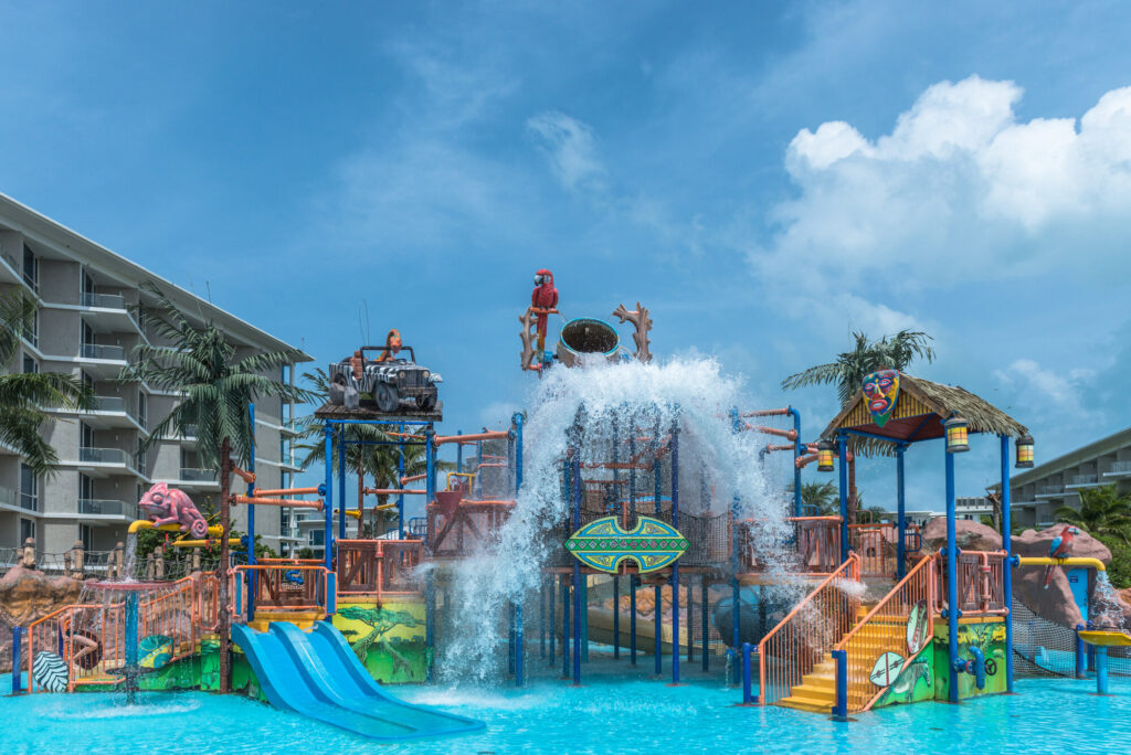 Aqua play fortress with water slides and tipping bucket at Splash Jungle Water Park, Phuket