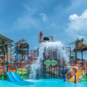 Aqua play fortress with water slides and tipping bucket at Splash Jungle Water Park, Phuket