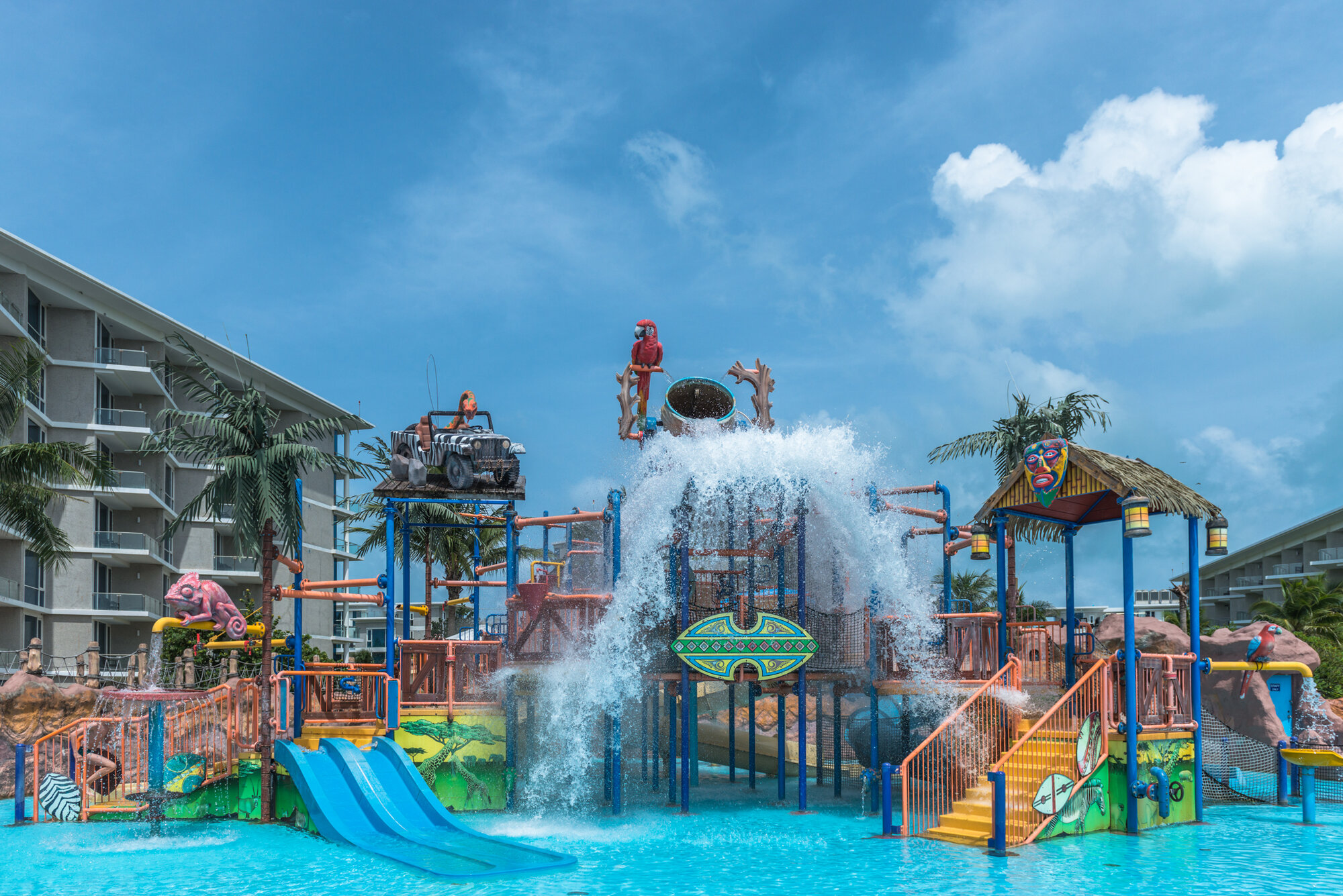 Aqua play fortress with water slides and tipping bucket at Splash Jungle Water Park, Phuket