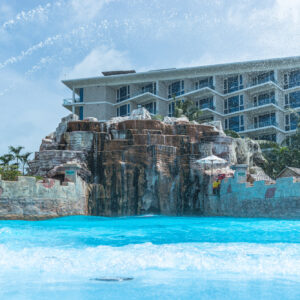 Wave pool with rock waterfall at Splash Jungle Water Park in Mai Khao, Phuket