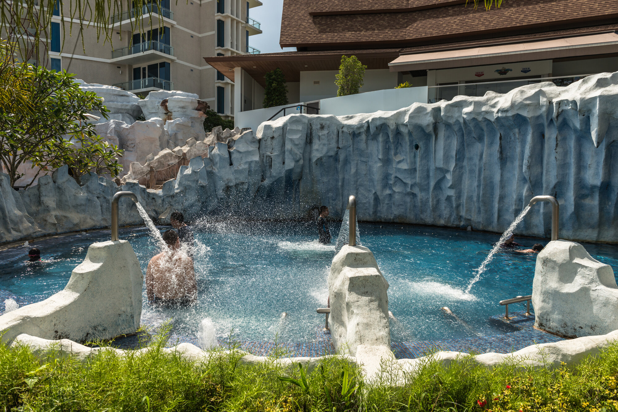 Spring pool with rock fountains at Splash Jungle Water Park