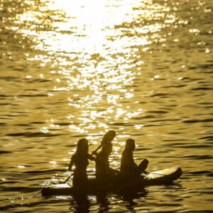 Guests silhouetted against the sunset