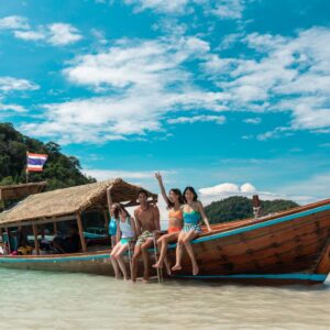 Guests on a longtail boat at a Surin beach