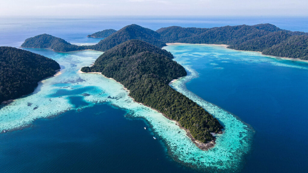 Aerial view of the Surin Islands and their shallow reefs