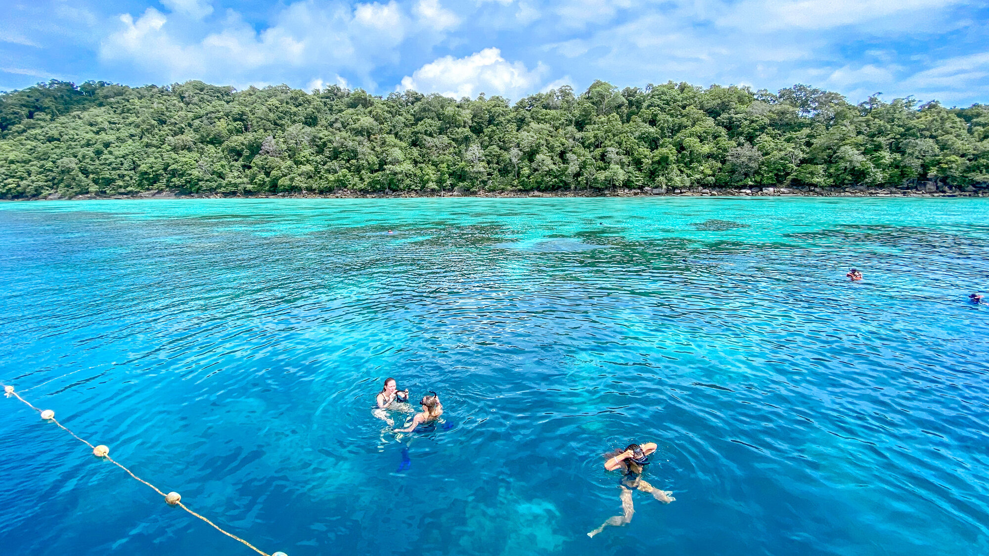 Snorkellers in clear water at the Surin Islands